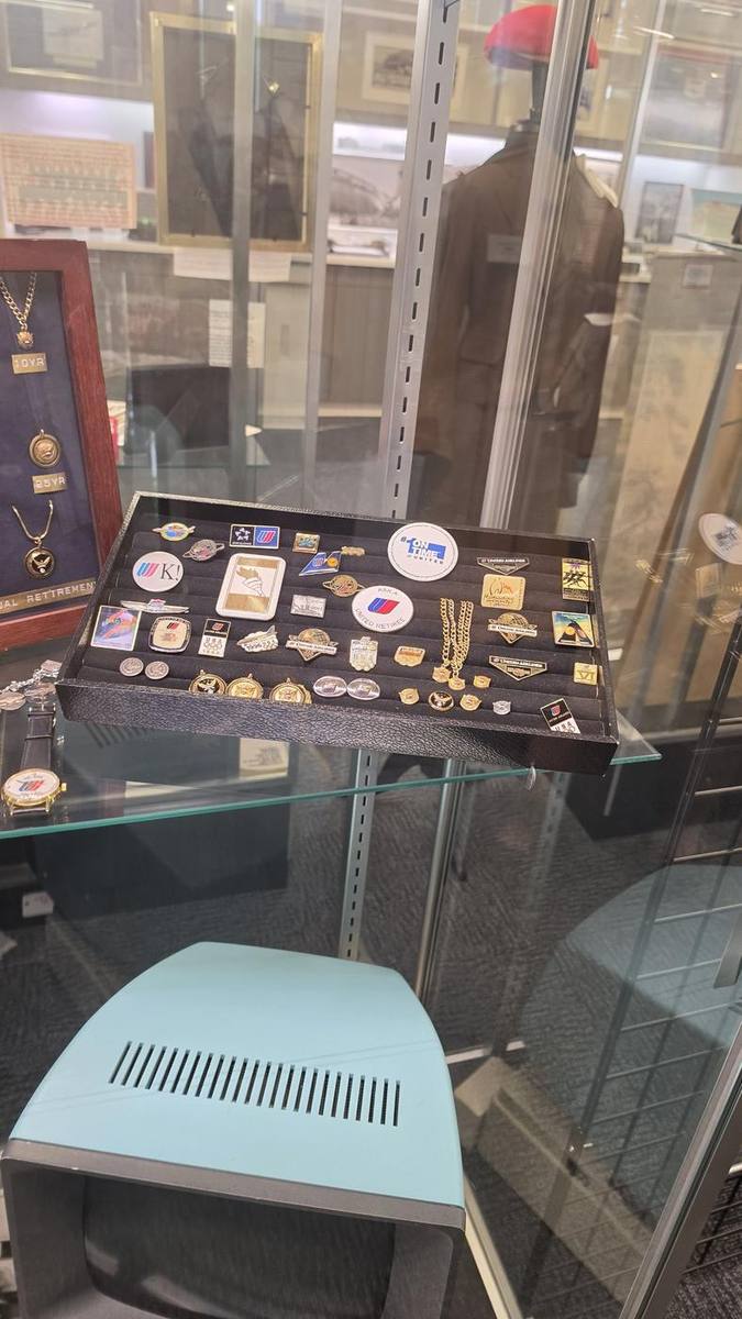 Case of pins, patches and badges