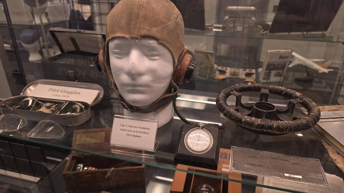Leather flying helmet, goggles and a pocket watch