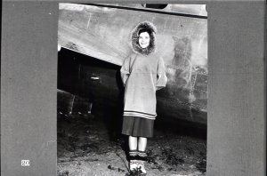 In the far north, this young lady and others like her fly for the Alaskan division of Pan American Airways...