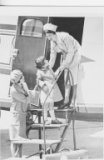 A gray nurse-like duster and cap were worn in flight. The duster would be worn over the green street uniform or alone and was meant to conve