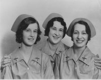 A gray nurse-like duster and cap were worn in flight. The duster would be worn over the green street uniform or alone and was meant to conve