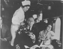 A gray nurse-like duster and cap were worn in flight. The duster would be worn over the green street uniform or alone and was meant to conve