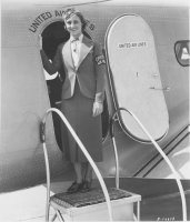 A sage green wool, single breasted jacket was worn over a yellow linen blouse with a collar. The blouse was accessorized with a dark green s