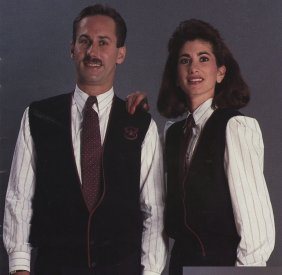 Both a long sleeve and sleeveless pullover sweater with a simulated button closure was issued in navy. They featured a deep V-neckline, burg