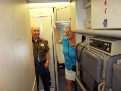 (Left) United workers and their families get the opportunity to take a guided tour of United’s Boeing 777 aircraft, after they get their pas