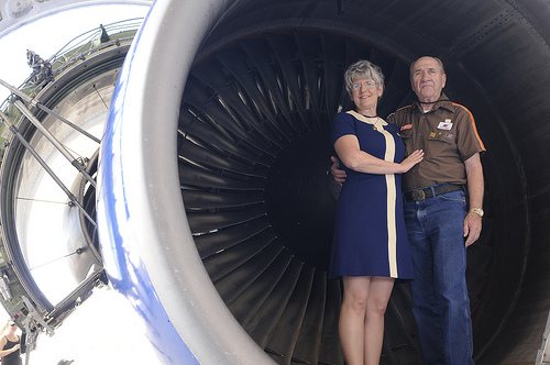 UAHF volunteer Terry Tress models a 1968-1970 flight attendant uniform and her husband Howard is wearing a shirt worn by UA ramp service emp