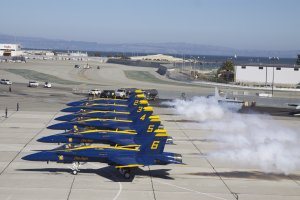 Left - The popular and inspiring Navy Blue Angels are being readied for takeoff to go to the downtown San Francisco area for an air show. Ri
