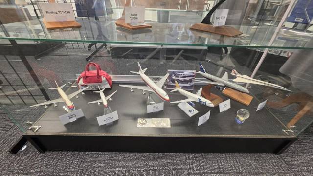 Boeing and Douglas models on a glass shelf