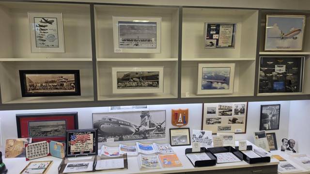 Shelves of archival photos, papers and memorabilia